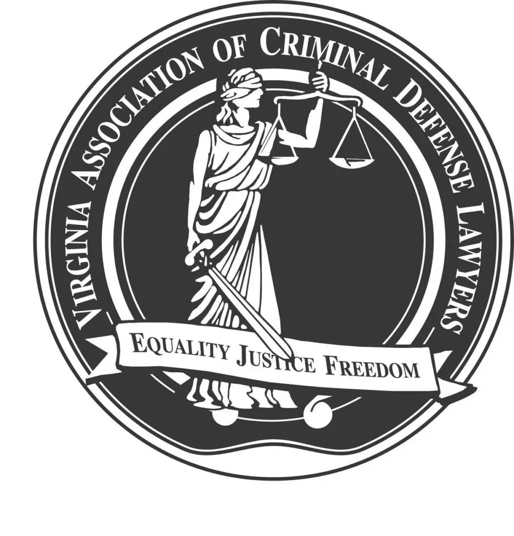 A black and white image of the virginia association of criminal defense lawyers logo.
